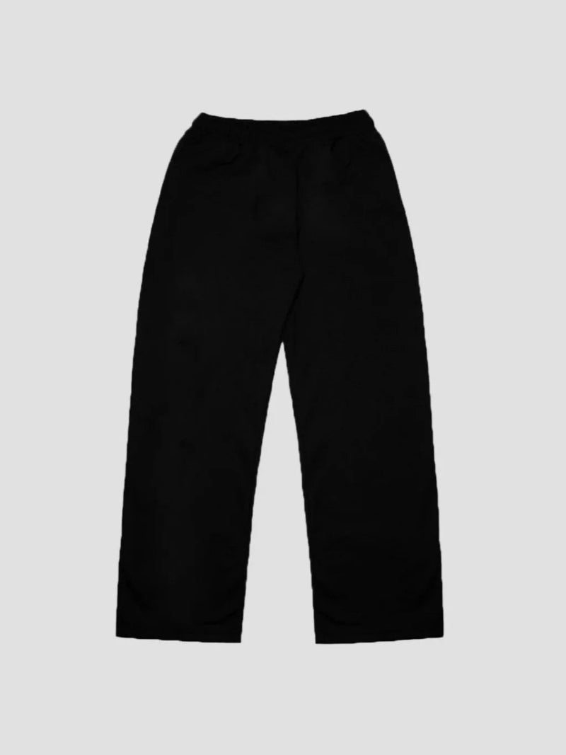 Black pants on a light gray background