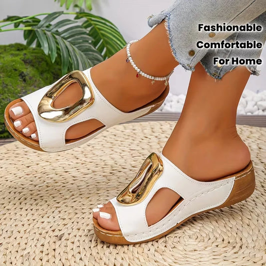 White sandals with gold accents worn by a person on a woven surface, with text 'Fashionable Comfortable For Home'.
