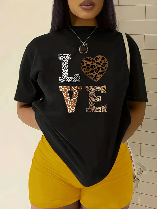 Person wearing a black t-shirt with 'I ♥️ U ♥️ E' design in leopard print.