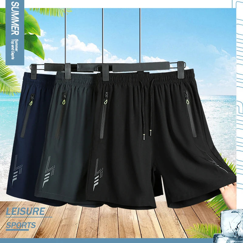 Black shorts hanging on a rack with a beach background