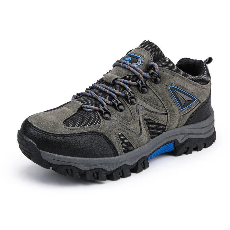 Gray hiking shoe with blue accents on a white background
