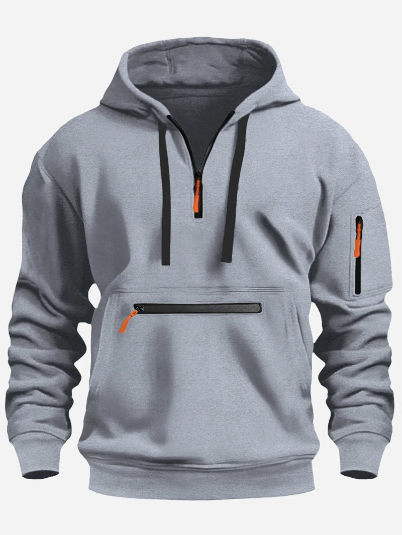 Gray hoodie with black and orange zippers on a white background