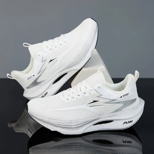 White athletic shoes with gray accents on a reflective surface and gray background