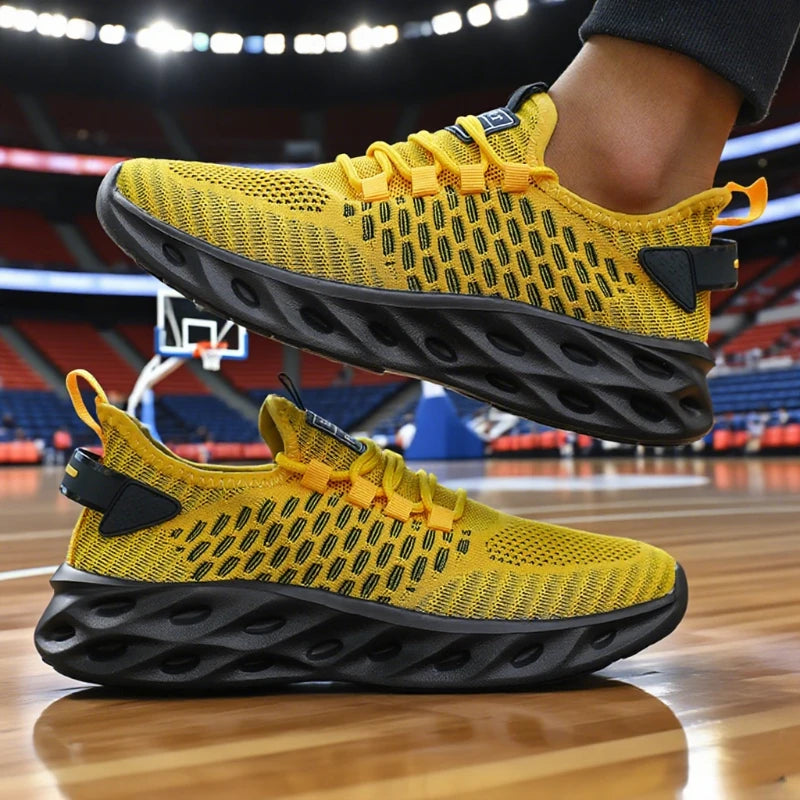 Yellow athletic shoes with black soles on a basketball court