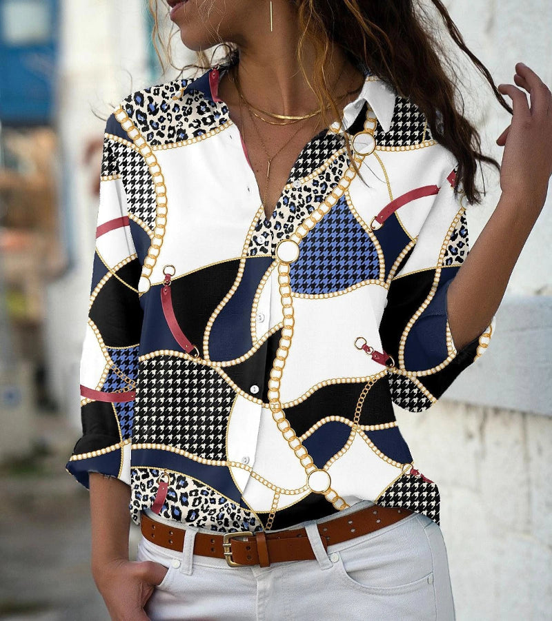 Woman wearing a patterned shirt with a blurred background