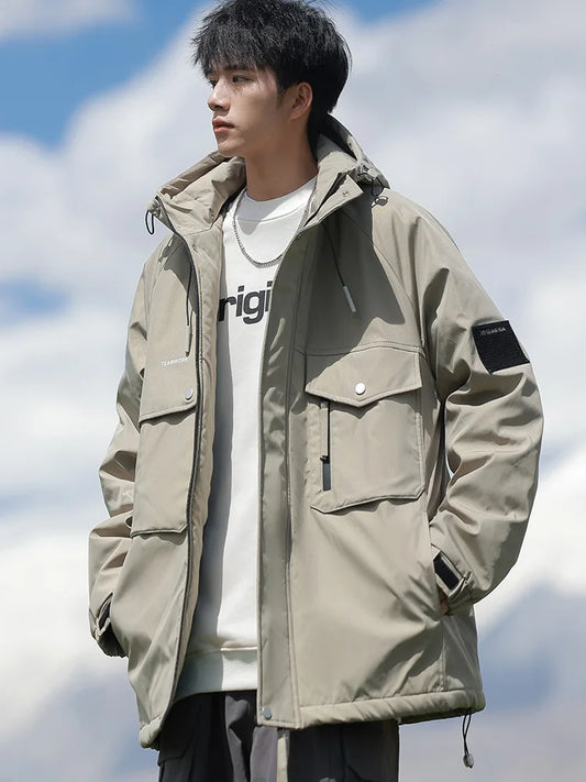Person wearing a beige jacket with a white cloud background
