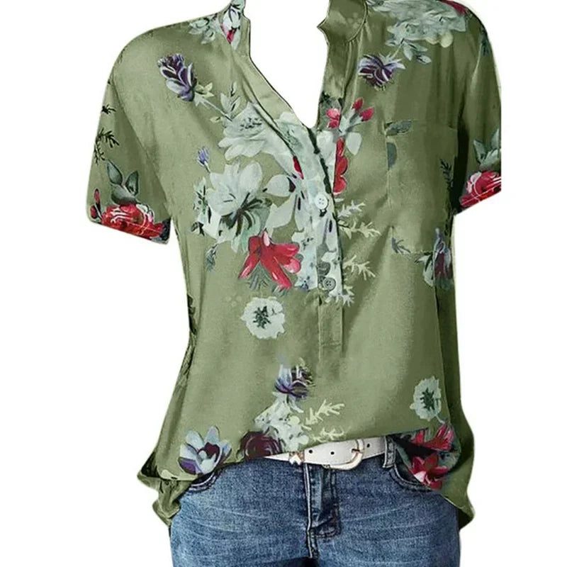 Green floral blouse with a white belt on a white background