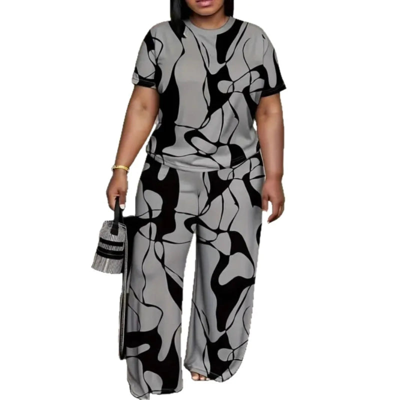 Woman wearing a gray and black patterned outfit with wide-leg pants on a white background