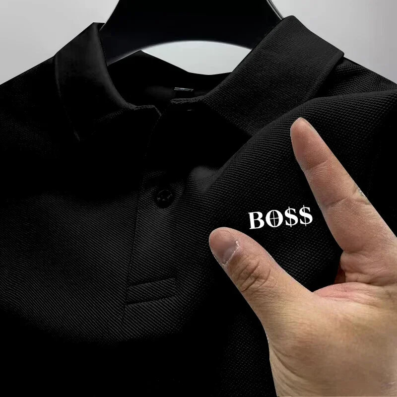 Black shirt with 'BOSS' text on a hanger, hand pointing to the text.