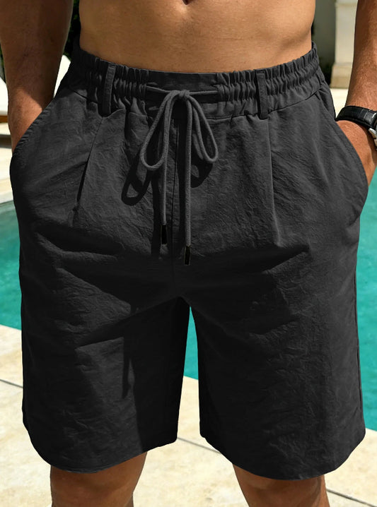 Person wearing black shorts with a blurred background