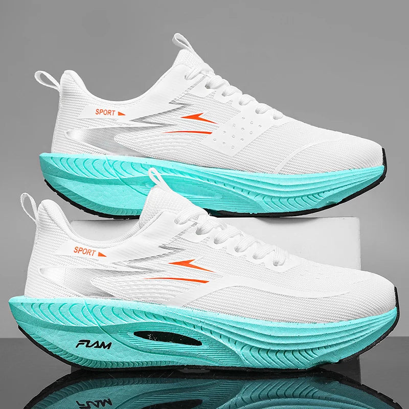 White running shoes with teal soles on a reflective surface and gray background