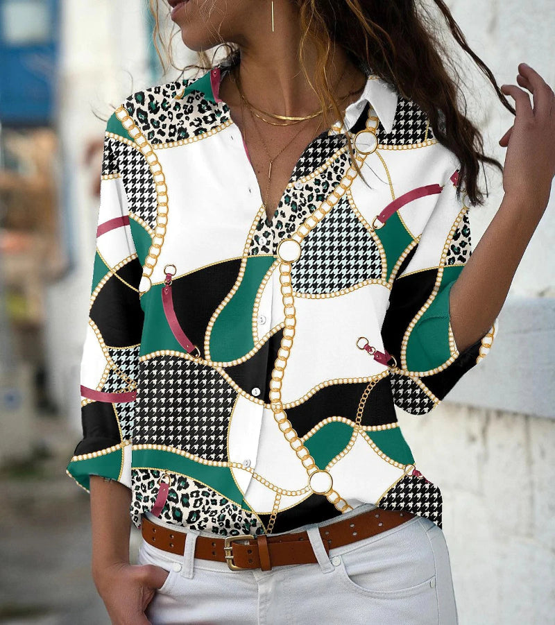Woman wearing a patterned blouse with a blurred background