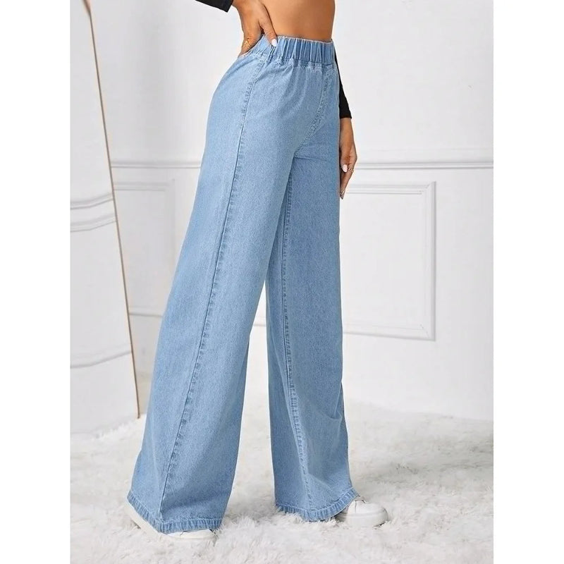 Light blue wide-leg jeans worn by a person on a white background