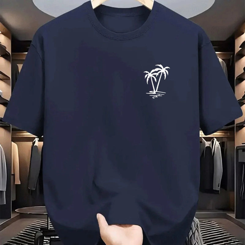 Navy blue t-shirt with a white palm tree design held in a clothing store.