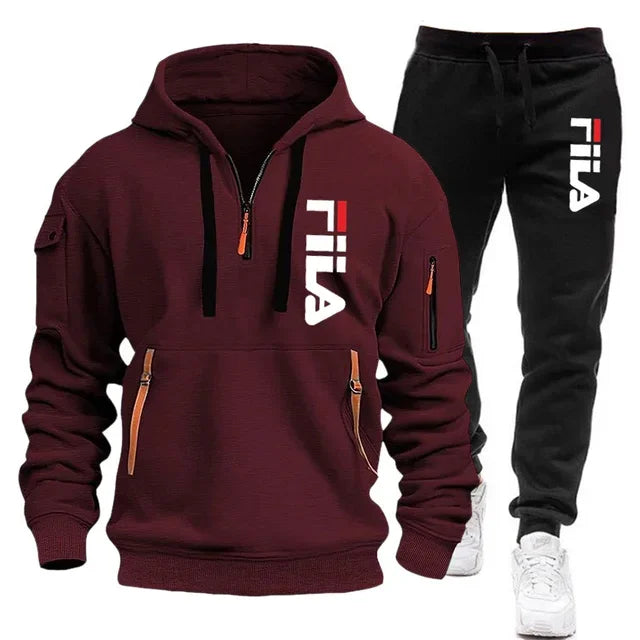 Maroon hoodie and black pants with Fila logo on a white background