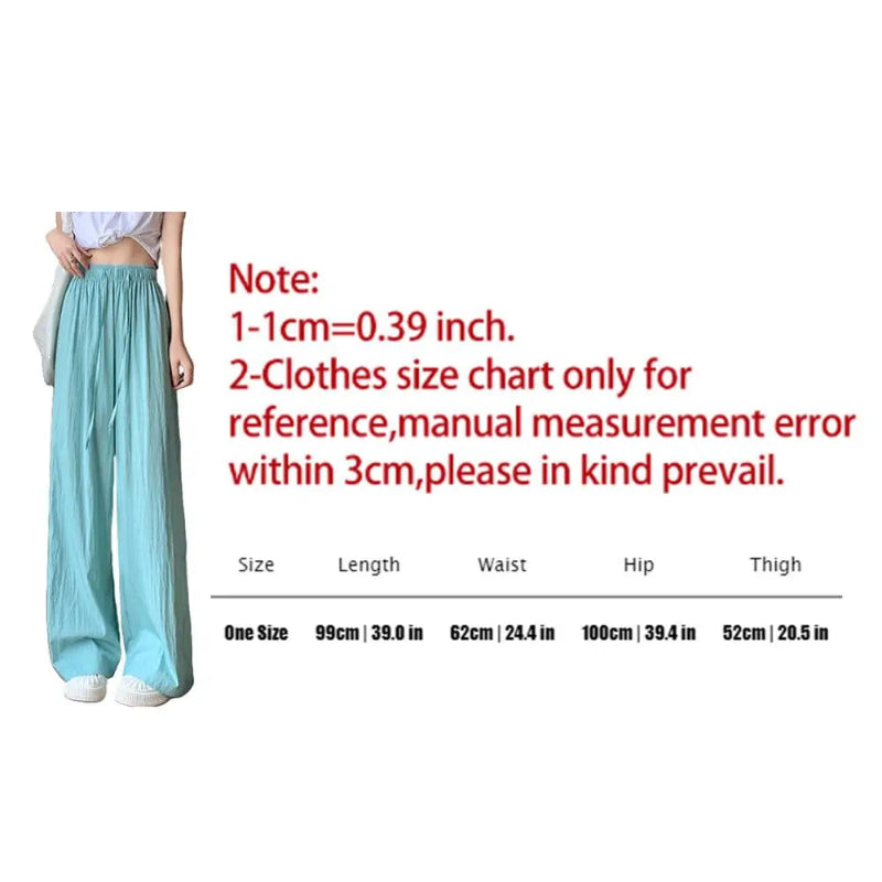 Teal pants with size chart and measurement notes on a white background