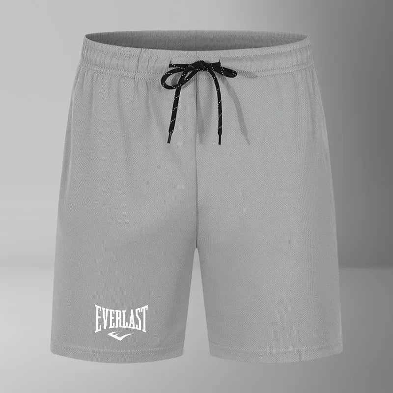 Gray shorts with a drawstring and 'Everlast' logo on a gray background