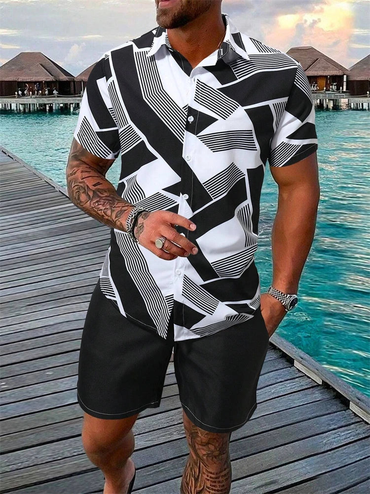 Man wearing a black and white patterned shirt and shorts by a waterfront.