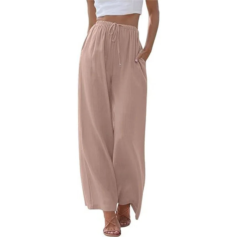 Beige wide-leg pants worn by a person on a white background