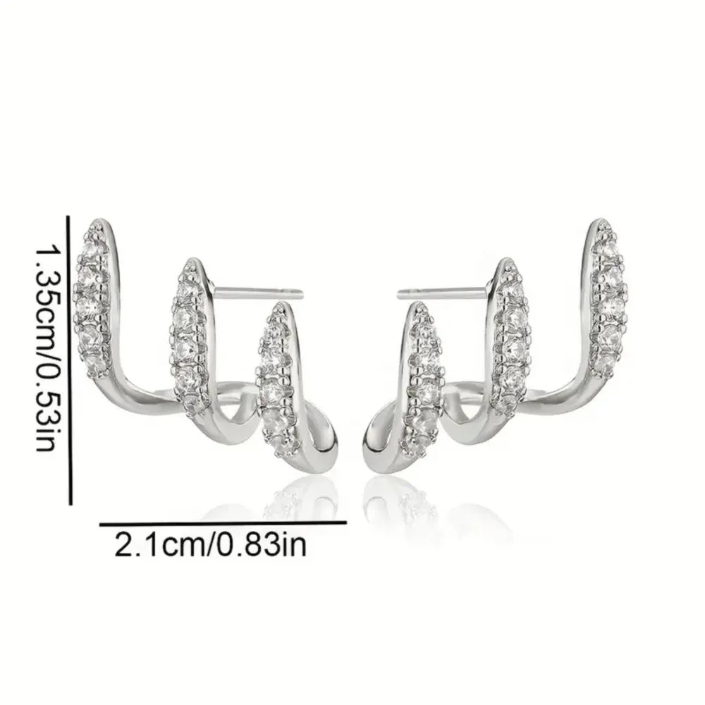 Silver hoop earrings with clear stones on a white background, showing measurements.