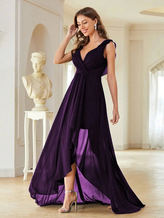 Woman wearing a purple evening gown in an elegant room.