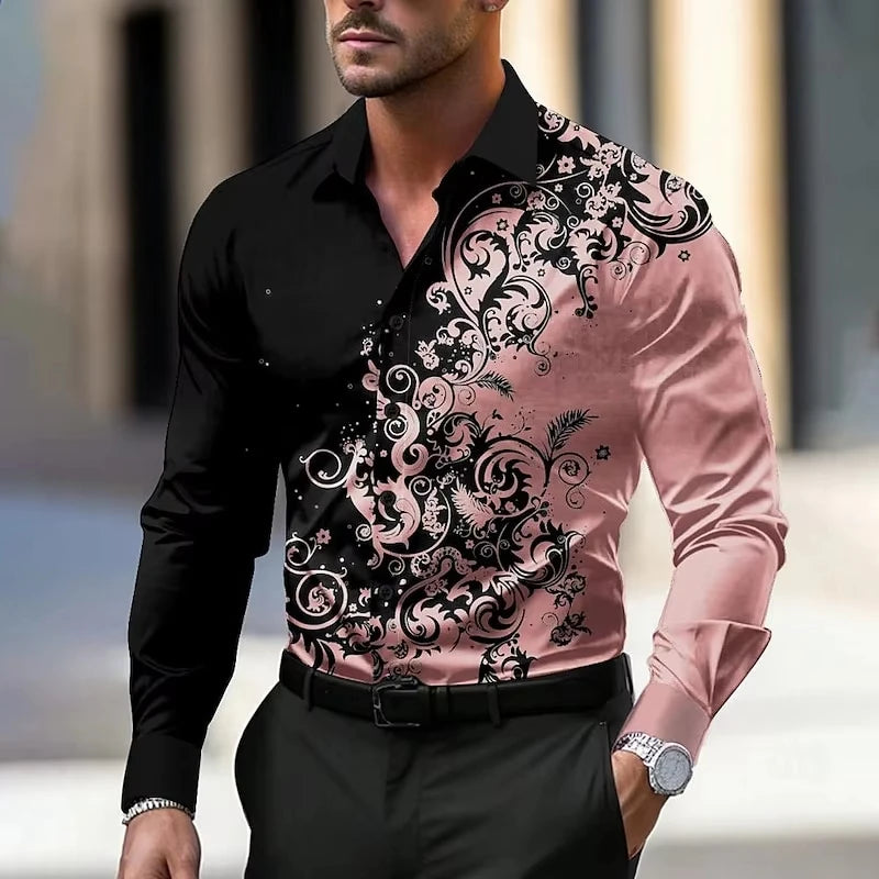 Man wearing a black and pink patterned shirt with a blurred background