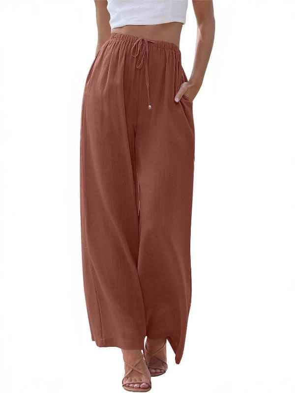 Brown wide-leg pants worn by a person on a white background