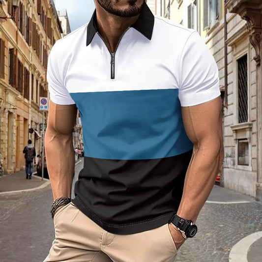A man wearing a color-blocked polo shirt with a white collar, blue chest panel, and black bottom. The shirt has short sleeves and a zipper at the chest.