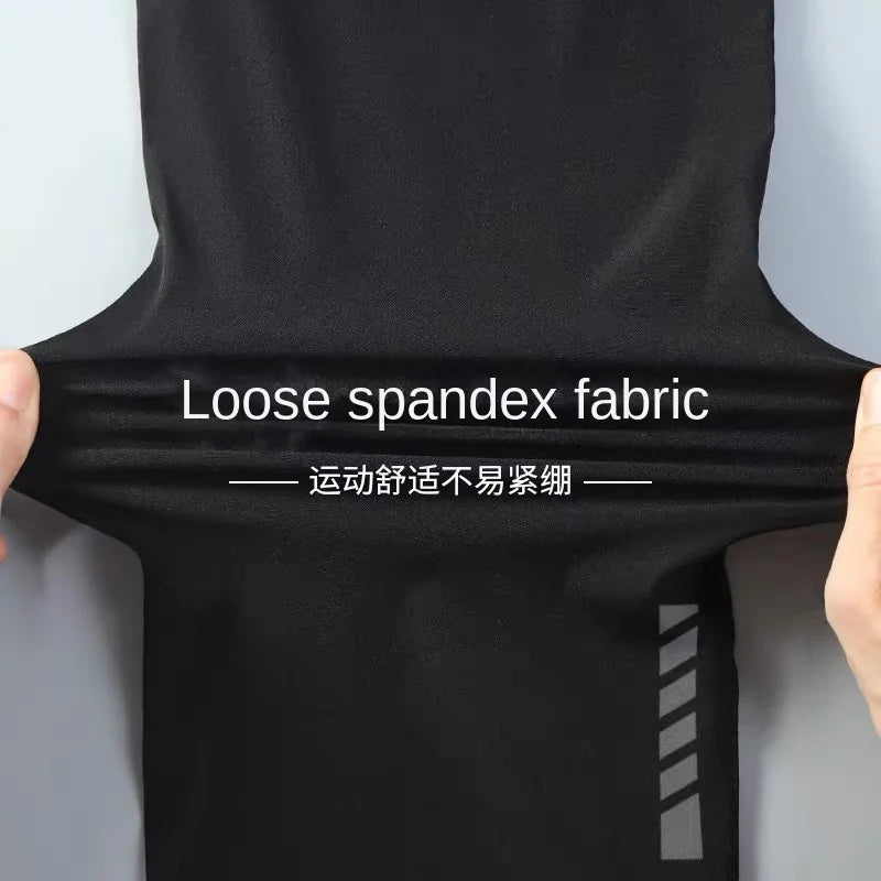 Black spandex fabric being stretched with text on a gray background