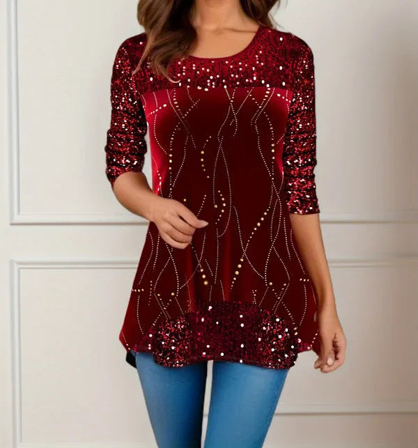 Red sequin top worn by a person against a neutral background