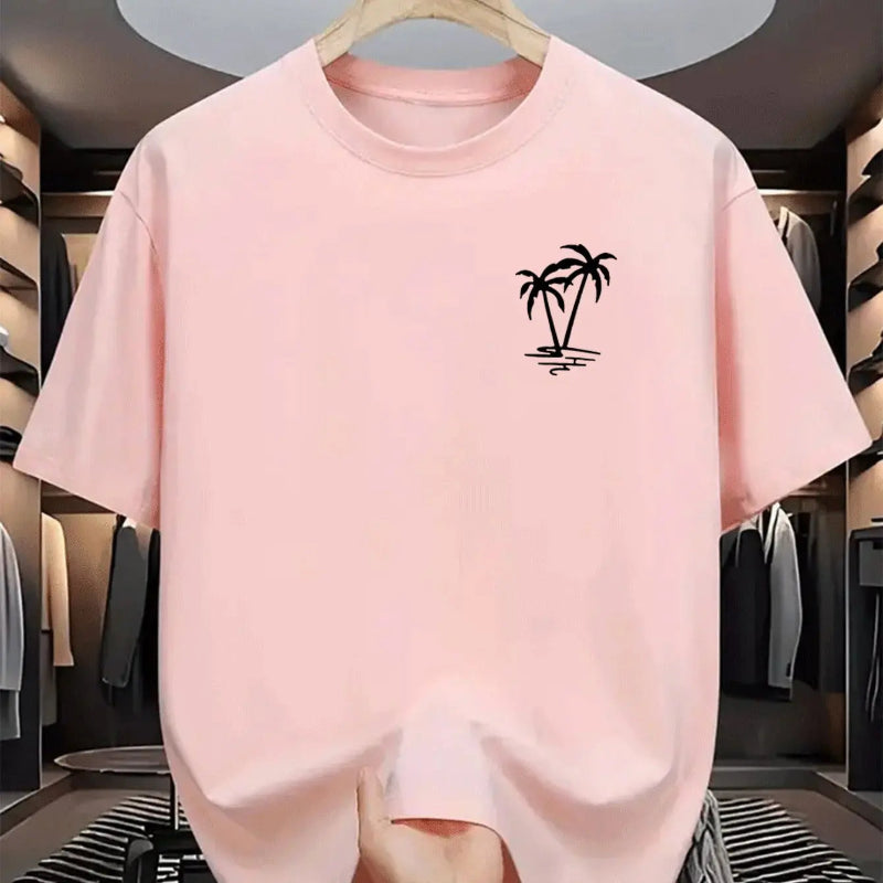 Pink t-shirt with a black palm tree design on a hanger in a clothing store.