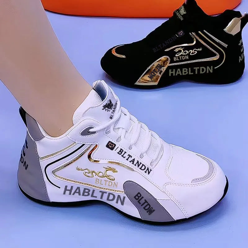 White and black sneakers with gold accents on a blue background