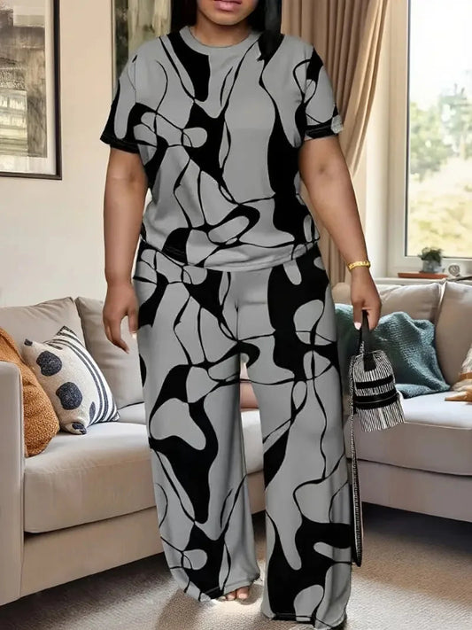 Woman wearing a black and white patterned outfit in a living room.