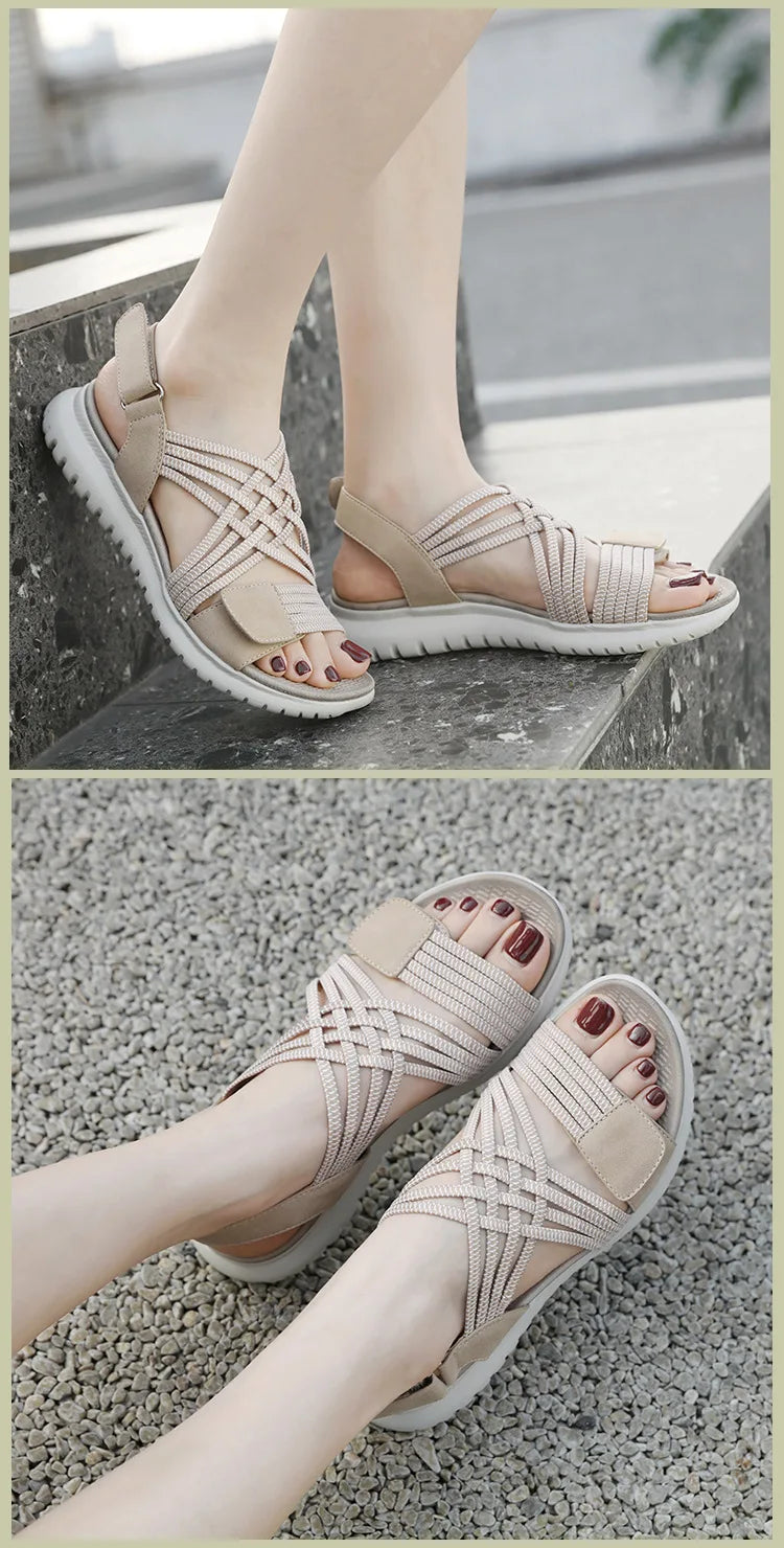 Beige sandals worn by a person on a stone surface