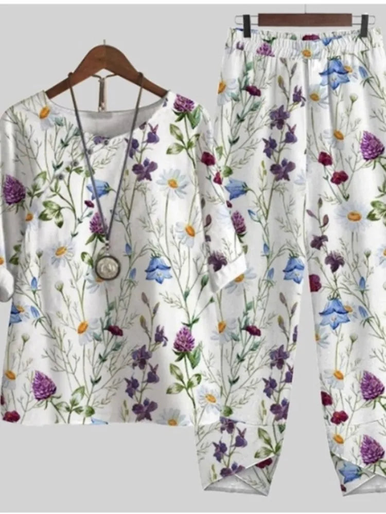 Floral-patterned outfit on a hanger against a light gray background