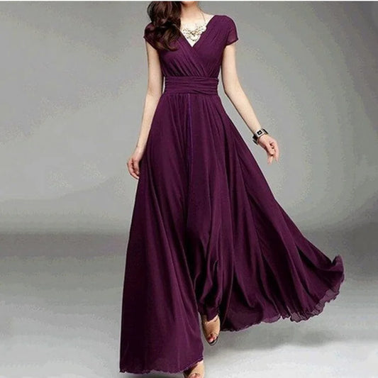 Purple evening gown on a model against a neutral background