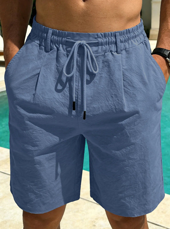 Blue shorts with drawstring on a blurred background