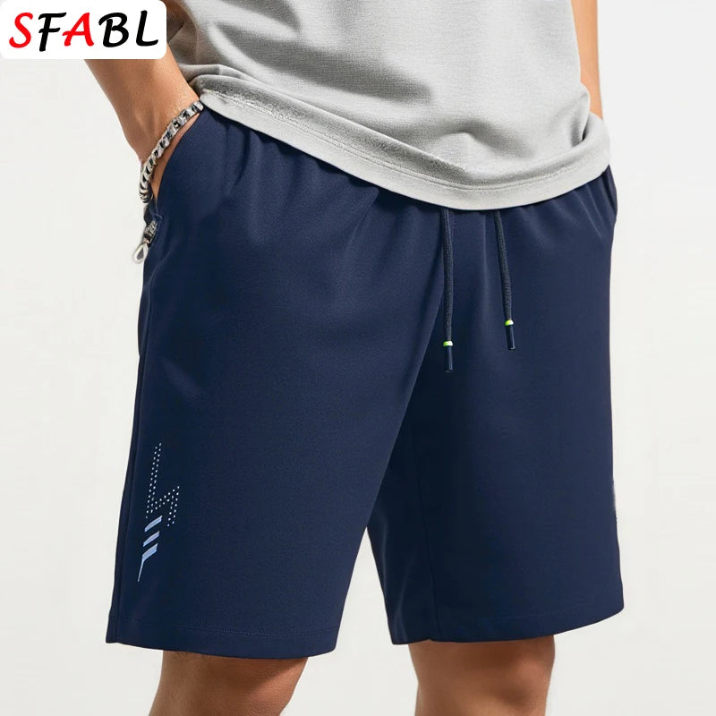 Navy blue shorts with a drawstring on a white background, featuring the brand 'SFABL'.