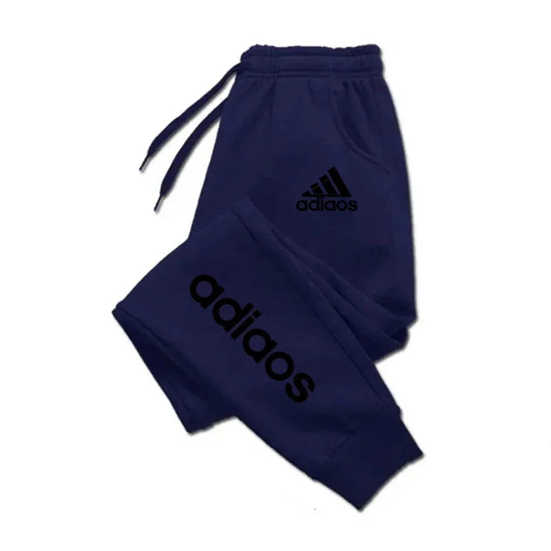 Navy blue Adidas tracksuit on a white background
