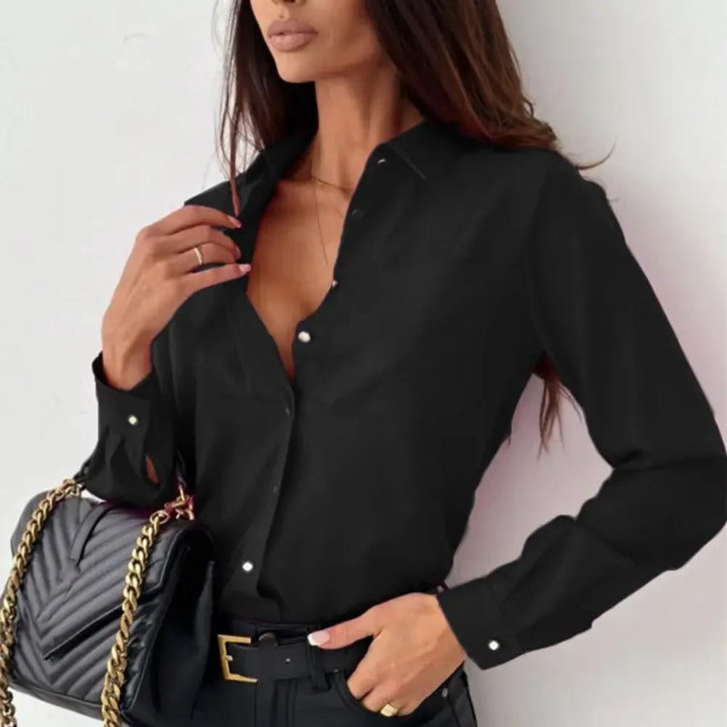 Woman wearing a black shirt with a gray handbag on a white background