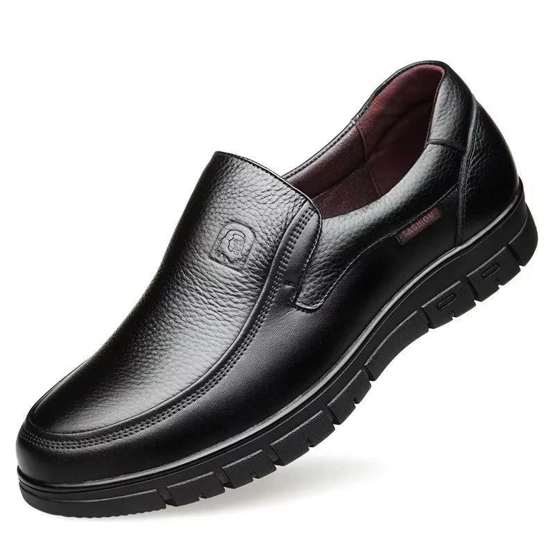 Black leather shoe on a white background