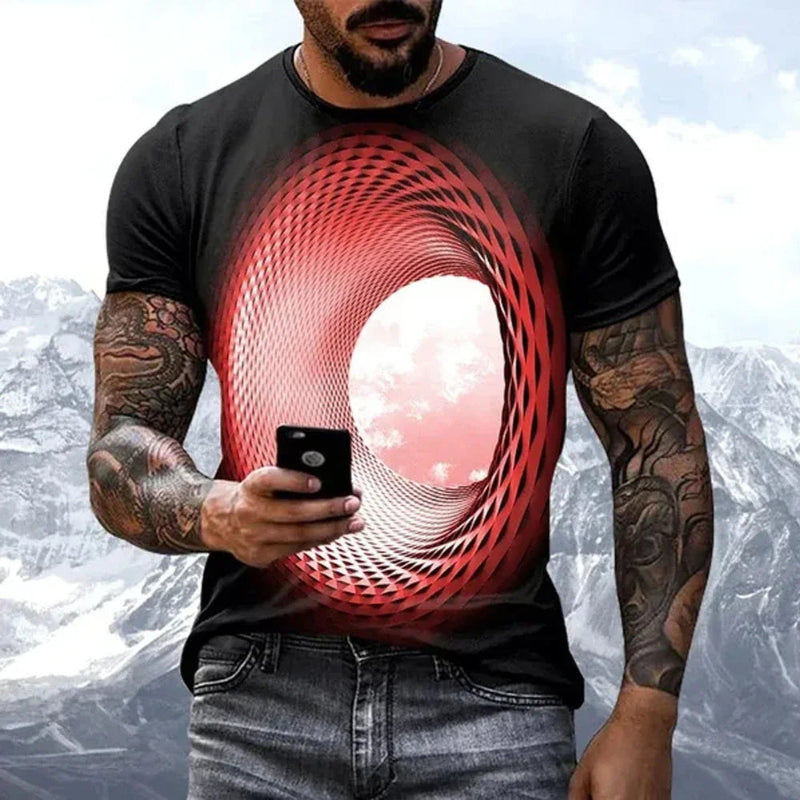 Man wearing a black t-shirt with a red and pink abstract design, holding a phone.