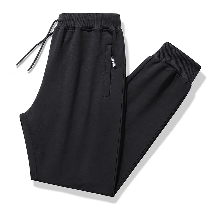 Black pants with drawstring and pocket on a white background