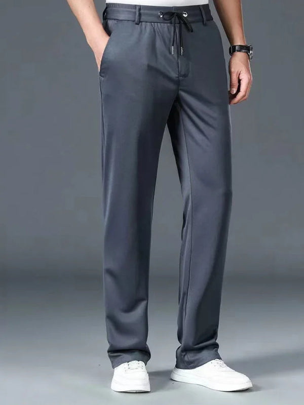 Gray pants worn by a person on a gray background