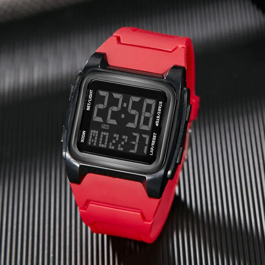 Digital watch with a red strap on a textured black background