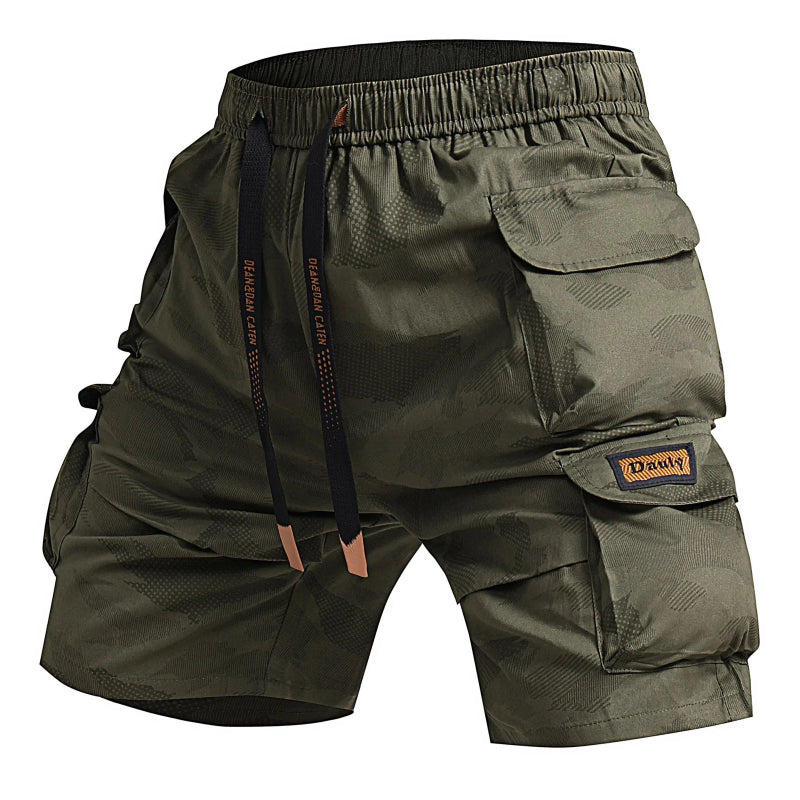 Green cargo shorts with multiple pockets on a white background