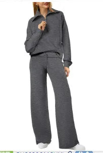Person wearing a gray outfit with a matching jacket and pants on a white background