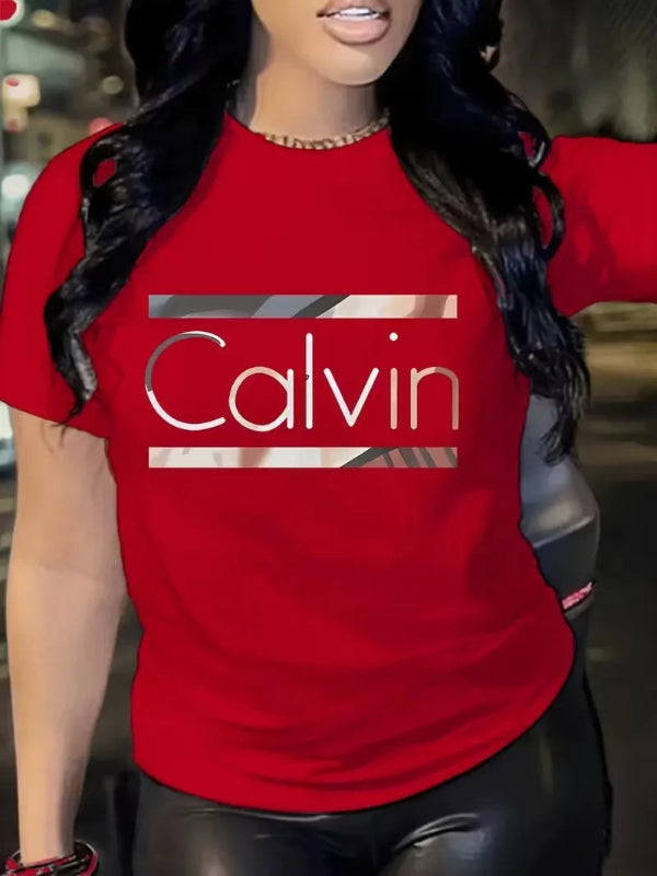 Person wearing a red 'Calvin' t-shirt with a blurred background