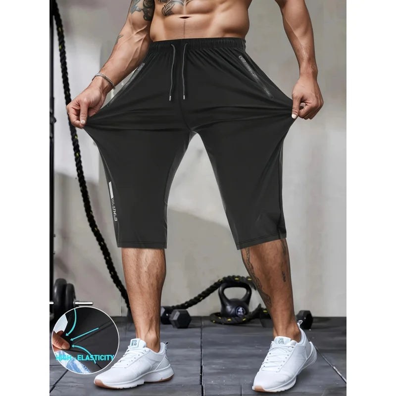 Person wearing black athletic shorts with a fitness background