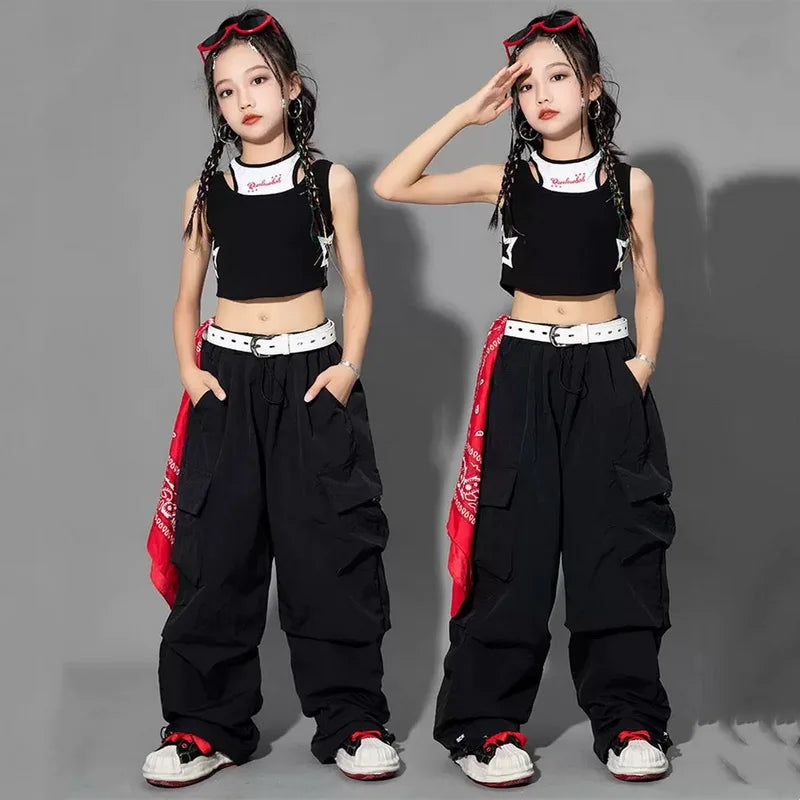 Two poses of a person wearing a black outfit with red accents on a gray background